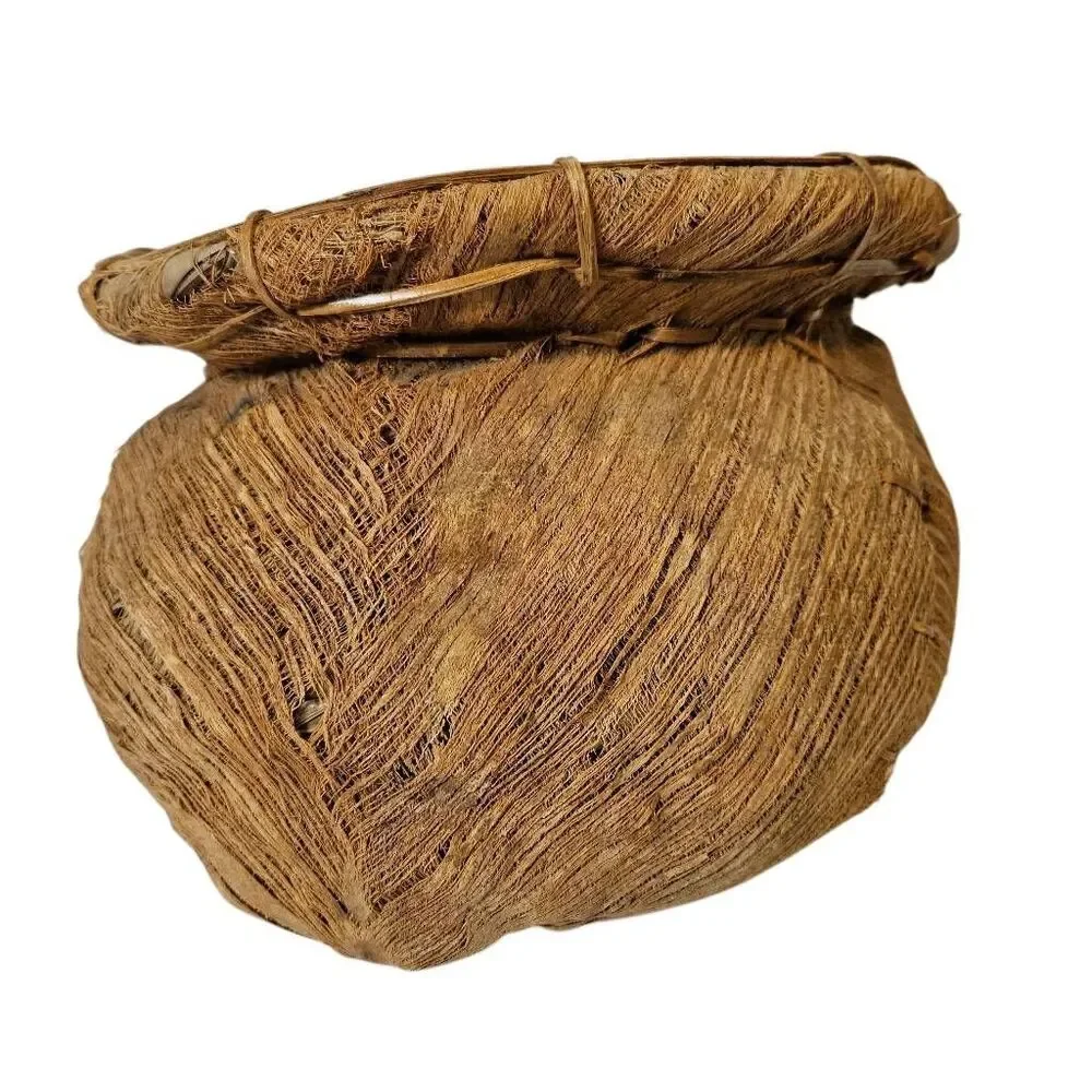 Primitive handmade basket, dried palm leaf woven.